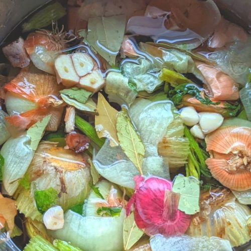 no salt vegetable stock with kitchen scraps onions garlic thyme bay leaves parsley and carrot top vegetable broth for low sodium soup recipes