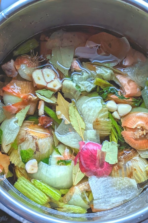 no salt vegetable stock with kitchen scraps onions garlic thyme bay leaves parsley and carrot top vegetable broth for low sodium soup recipes