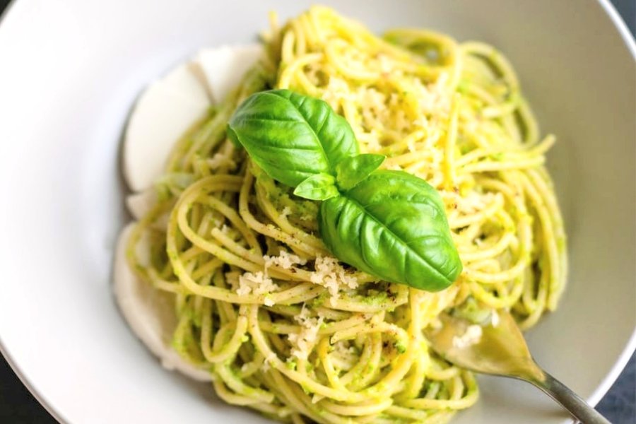 no salt pesto sauce low sodium pesto without salt but has pine nuts pignoles fresh italian genovese basil over pasta in a bowl.