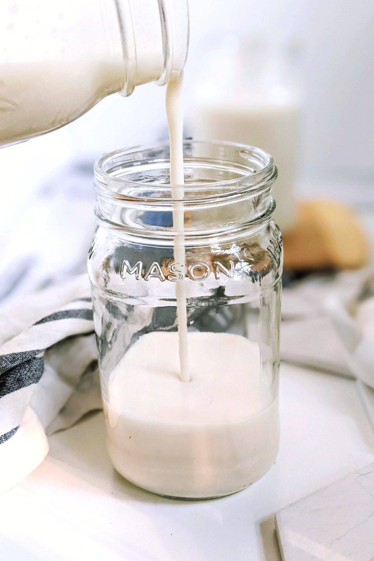 low sodium milk recipe with almond and water no salt added almond milk without preservatives healthy almond milk being poured into a mason jar