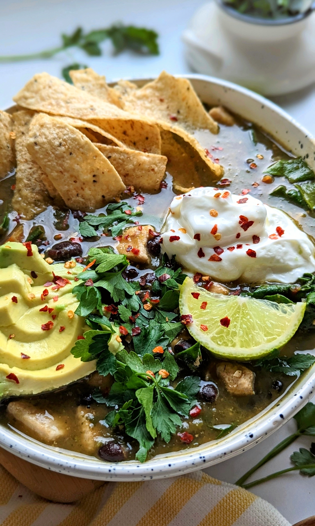 low salt chicken tortilla soup recipe with black beans avocado sour cream red chili pepper flakes butternut squash onions and swiss chard.