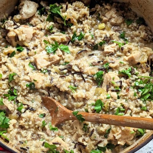 low sodium chicken casserole recipe with mushrooms celery onions garlic and brown rice and wild rice in a Dutch oven