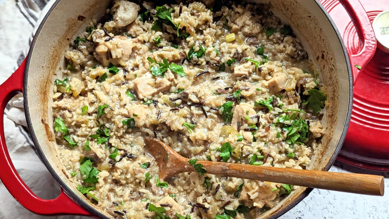 low sodium chicken casserole recipe with mushrooms celery onions garlic and brown rice and wild rice in a Dutch oven