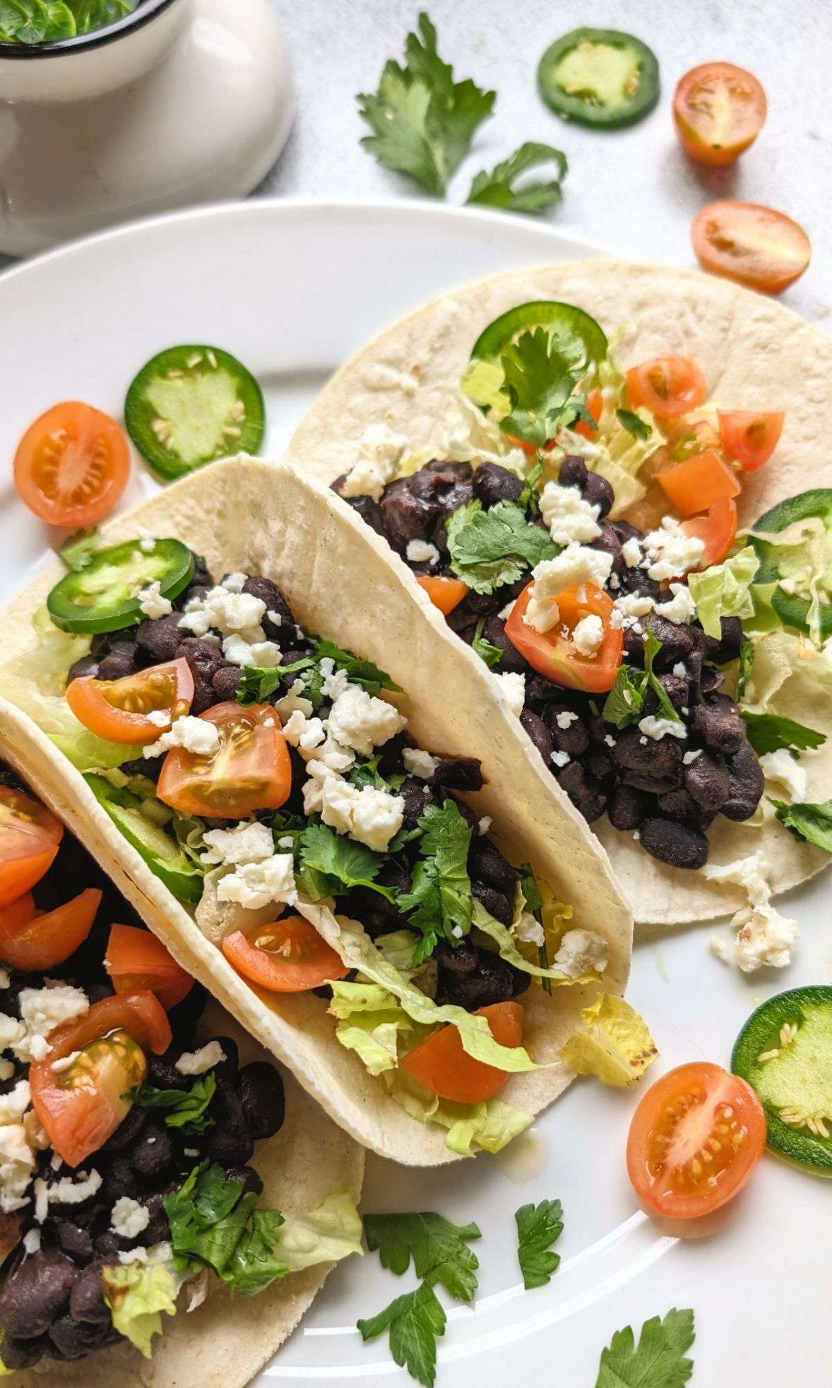 low sodium tacos with black beans tomatoes sliced jalapeno peppers cilantro and queso blanco low salt cheese