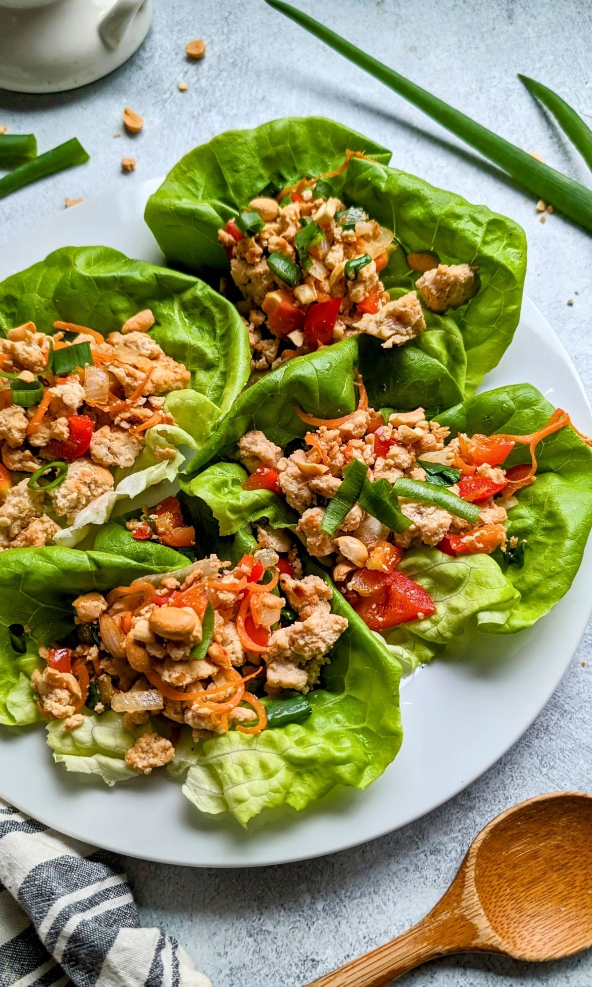 low salt chicken recipes in a lettuce cup with fresh chopped vegetables on a plate