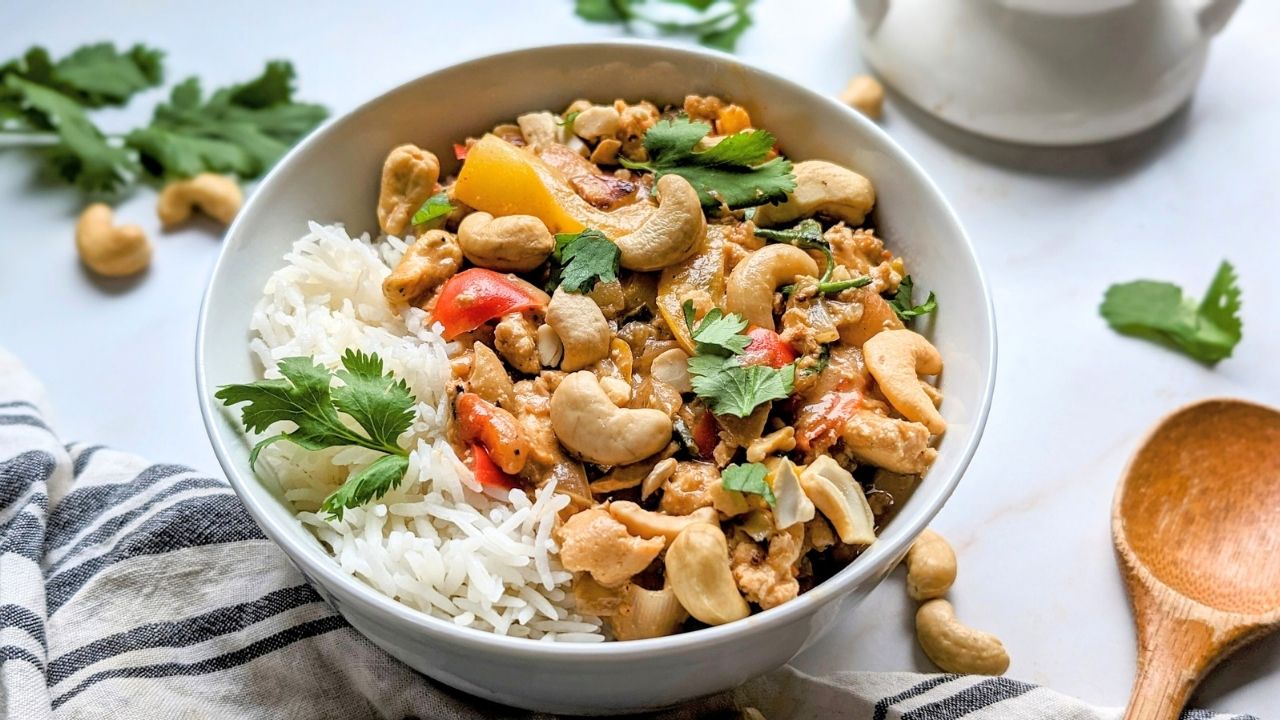 easy low salt cashew chicken with vegetables in a creamy unsalted nut sauce recipe over white rice with peanuts and green onions