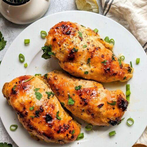 low sodium chicken breasts coated in apricot preserves on a plate with green onions and fresh parsley for dinner