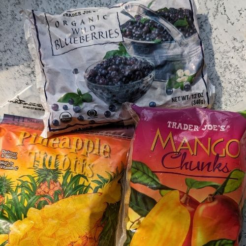 trader joe's frozen fruits like organic wild blueberries, pineapple tidbits, and mango chunks