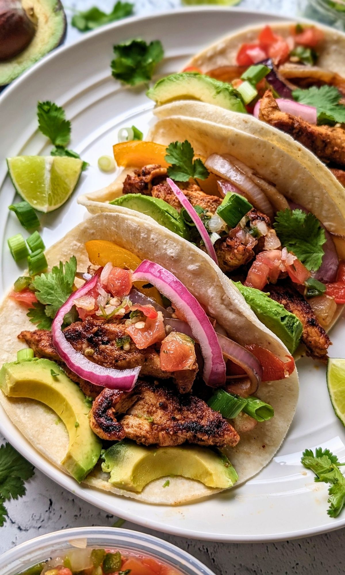 low sodium fajita recipe with boneless skinless chicken breast and vegetables in a no-salt-added corn tortillas with bright and fresh vegetable toppings
