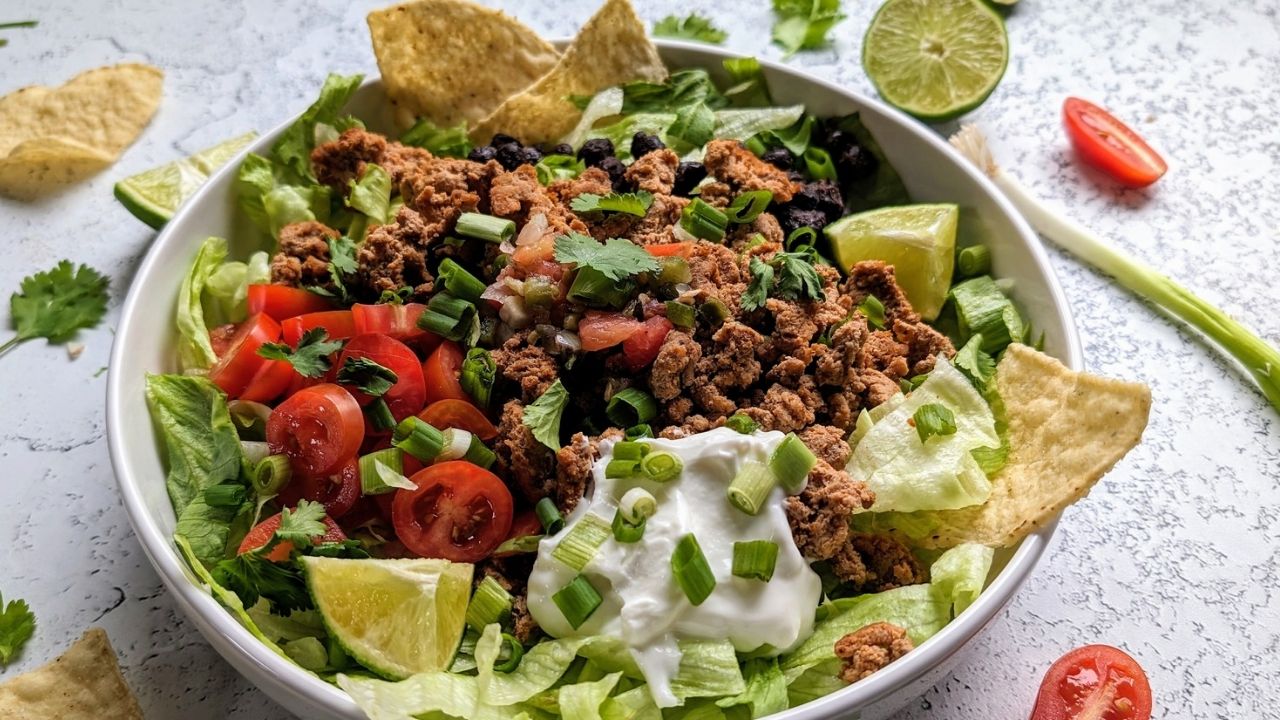 low sodium taco bowl with turkey, chips, sour cream, tomatoes, black beans, and fresh veggies