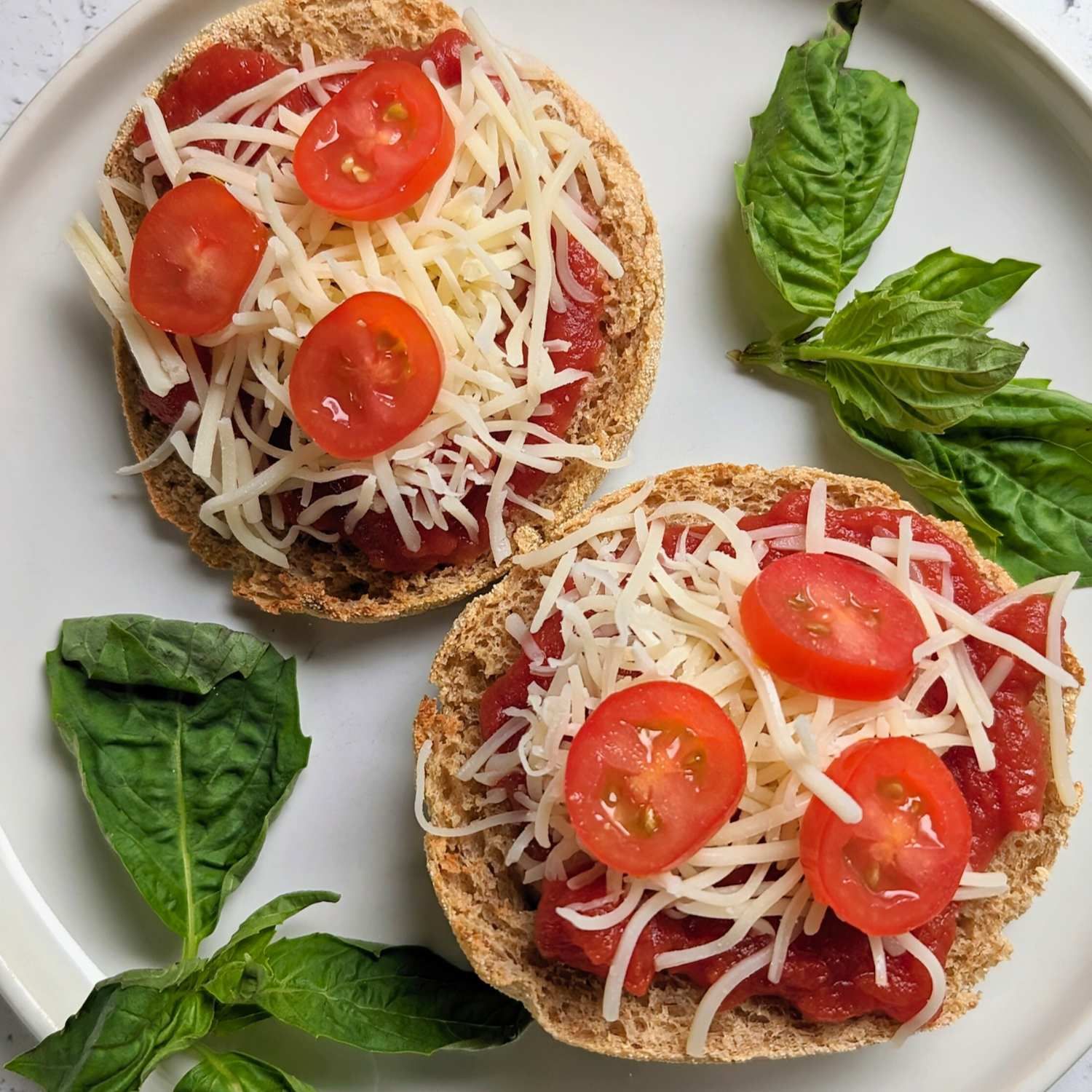 low sodium pizzas on english muffins topped with no salt added pizza sauce fresh cherry tomatoes fresh basil and low salt cheese