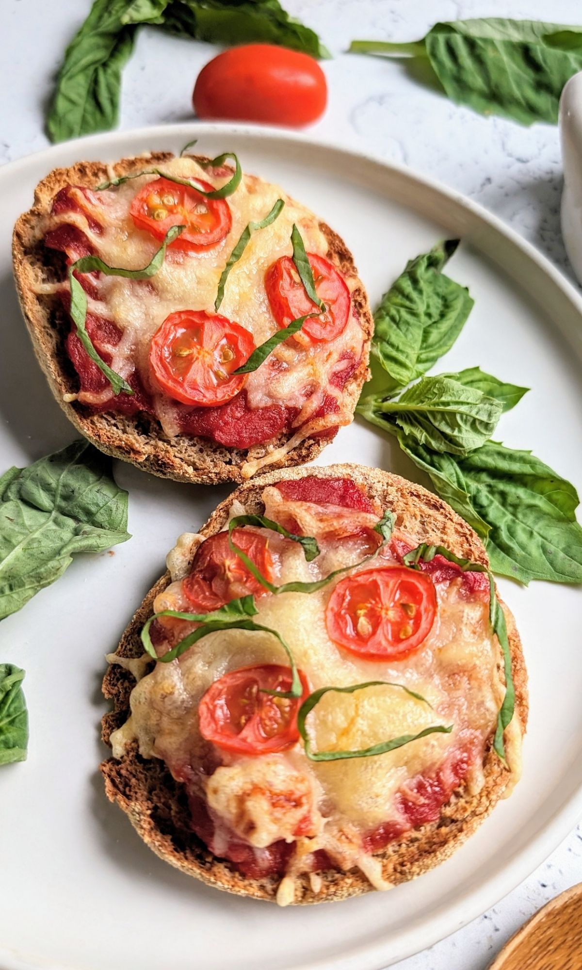 low sodium pizza recipe on english muffins topped with salt free pizza sauce and fresh herbs