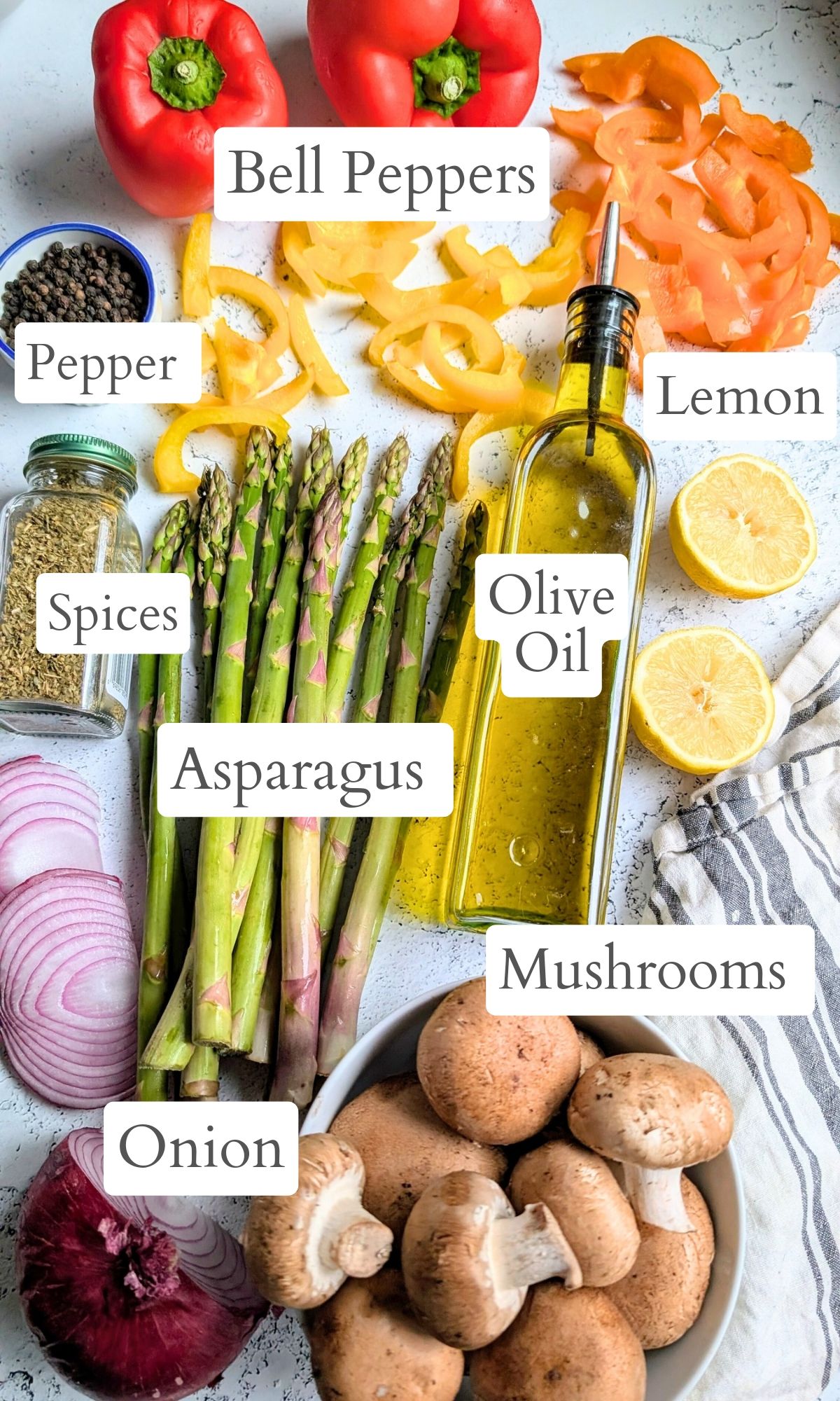 ingredients for low sodium grilled veggies like bell peppers, olive oil, lemon, garlic, onion, mushrooms, and asparagus.