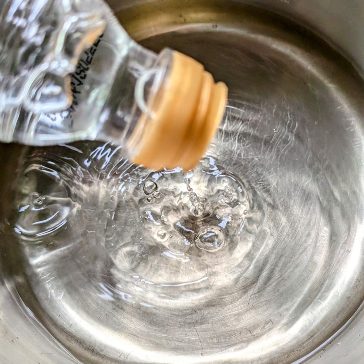 white wine vinegar in a pot being heated for brine.