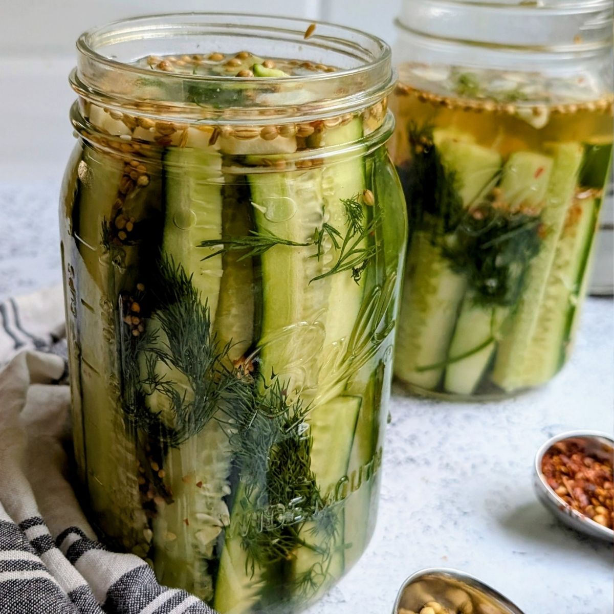 low sodium dill pickles in a mason jar with fresh dill and spices.