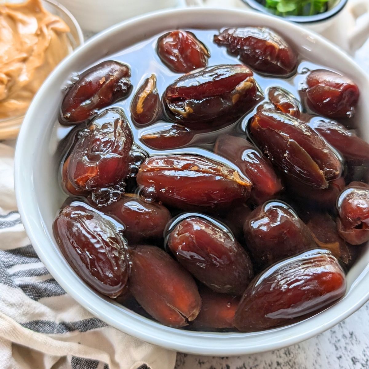 dates soaked in water to make protein ball snacks that are low in sodium