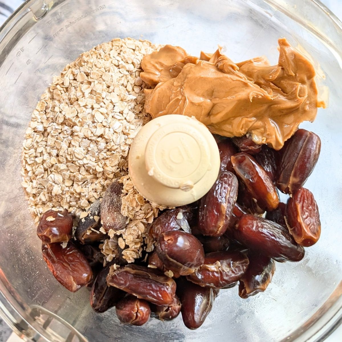 a food processor with oats, dates, and unsalted peanut butter to make a great treat or snack.