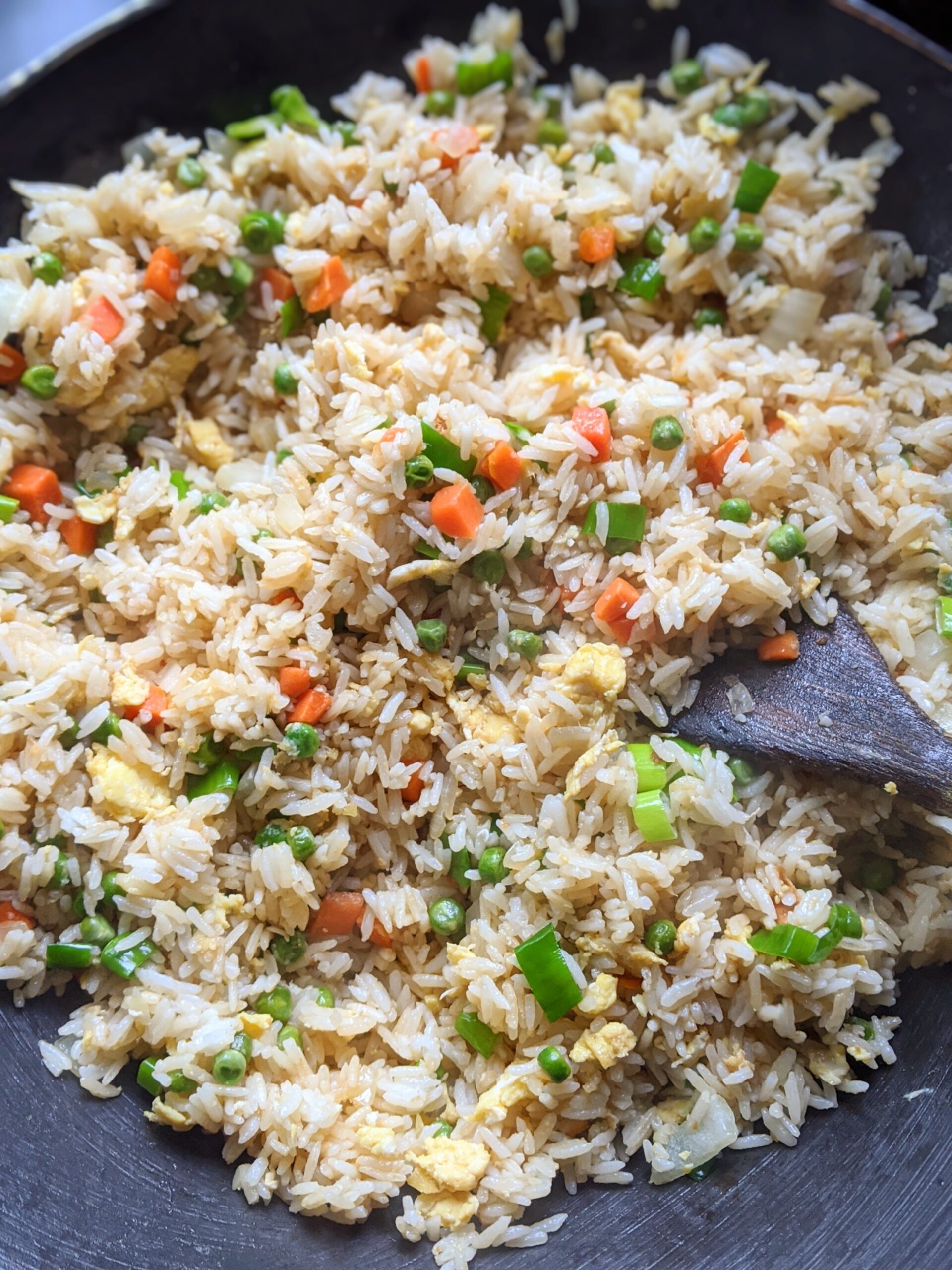 a wok filled with fried rice that is low in sodium and low in salt.