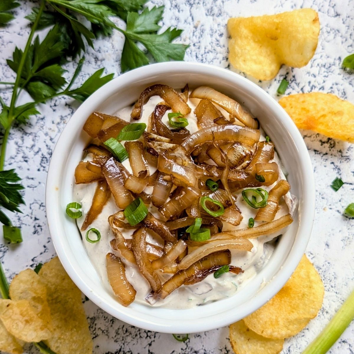 low sodium onion dip with caramelized onions and herbs ready for potato chips!