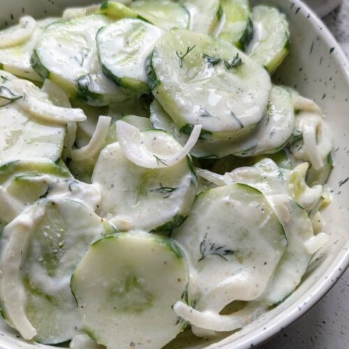 low sodium cucumber salad with onions and sour cream with fresh dill and vinegar.