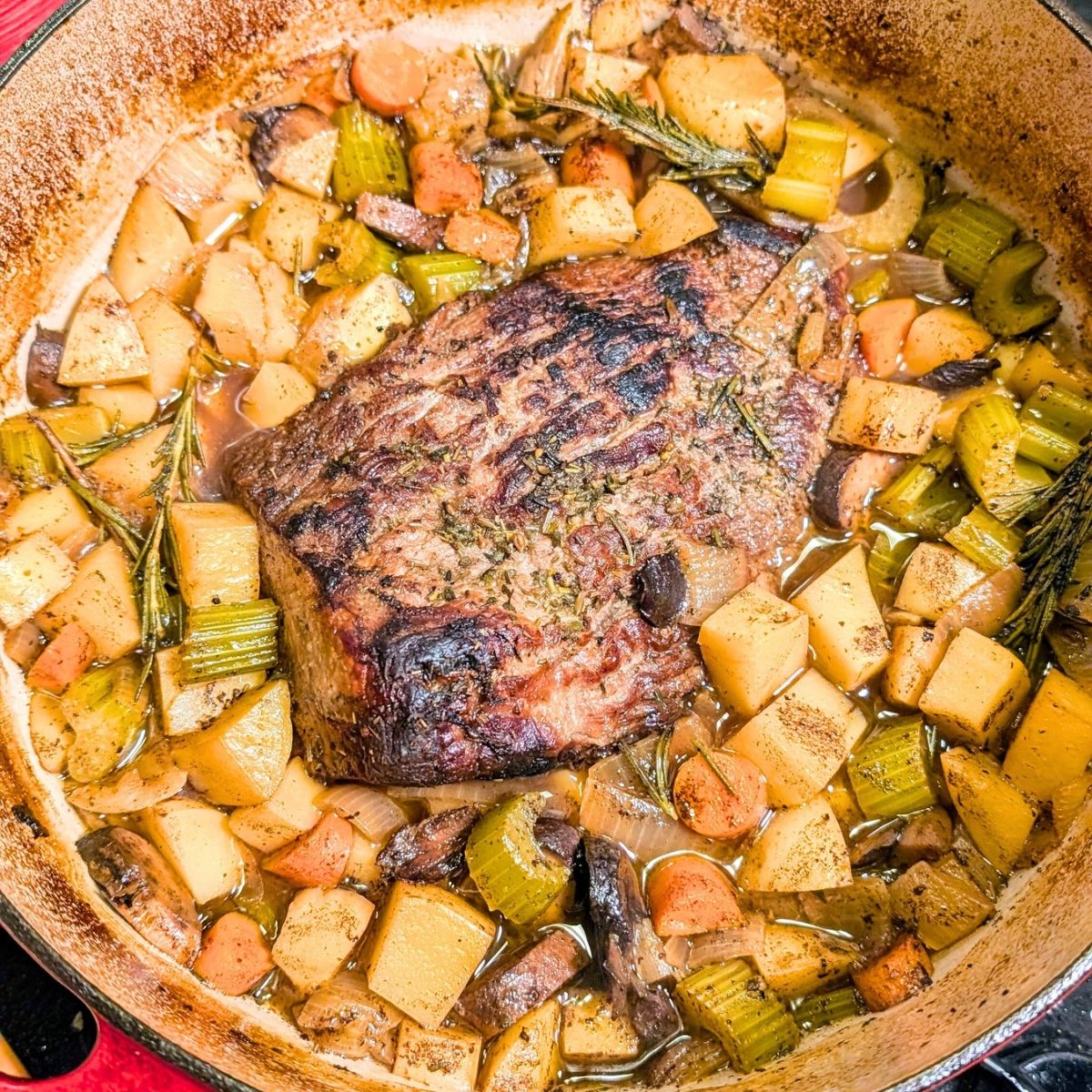 low sodium pot roast oven bakes with potatoes and onions and herbs.