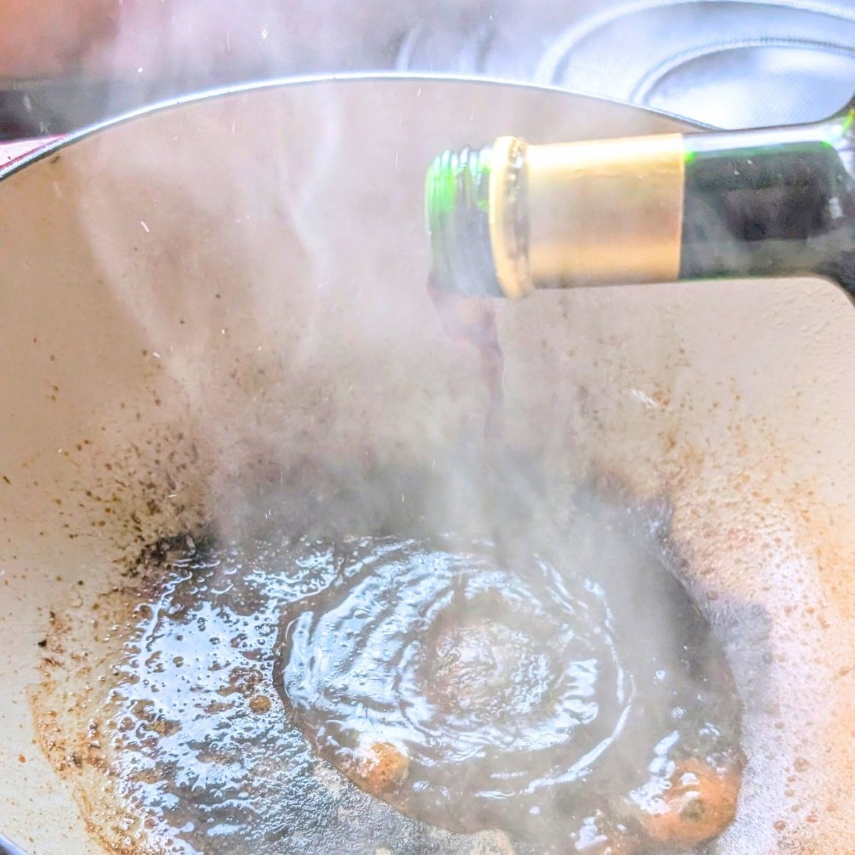 balsamic vinegar deglazing a pot roast pan dutch oven.