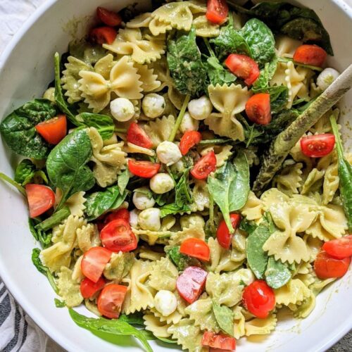 low sodium pasta salad with spinach, basil, mozzarella, and fresh tomatoes in a pesto dressing.