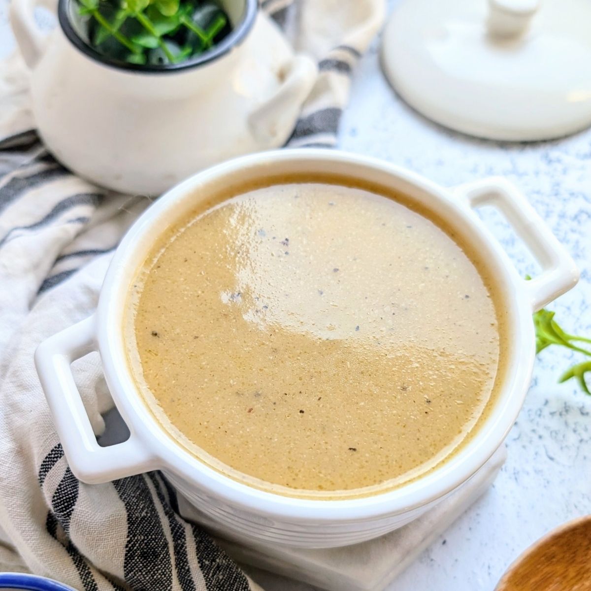 a beautiful ramekin of low sodium gravy recipe ready for chicken or turkey dinner or mashed potatoes.