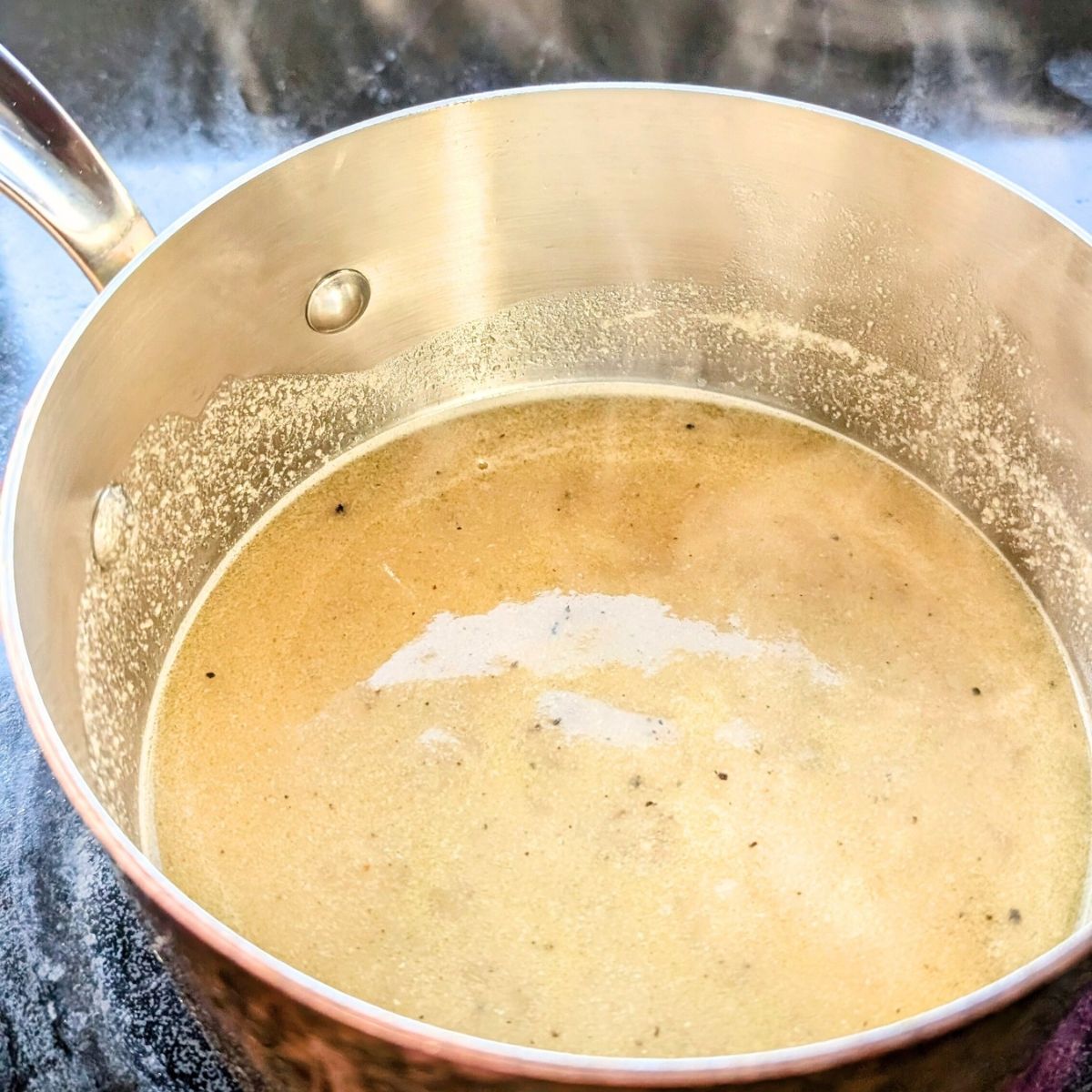 a simmering pan of low sodium gravy for turkey chicken or pot roast.