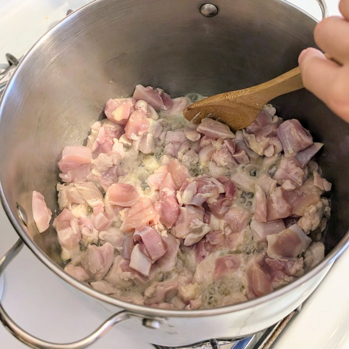 chicken thighs cooked in a pot to make low sodium chicken and dumplings