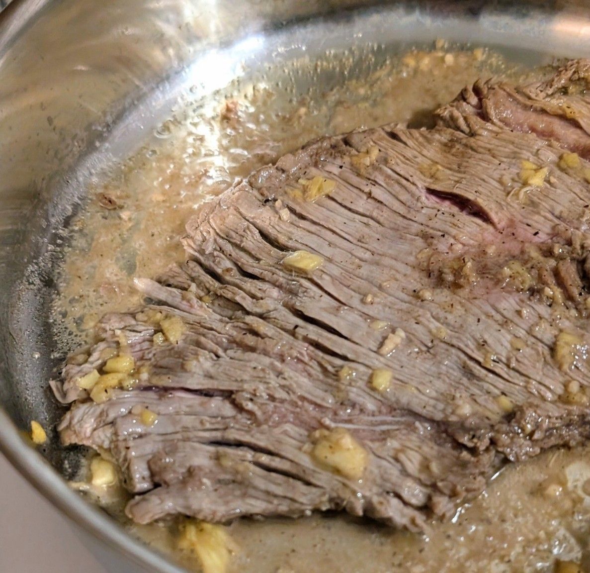 a pan of low sodium steak for stir fry with vegetables and a pineapple stir fry sauce