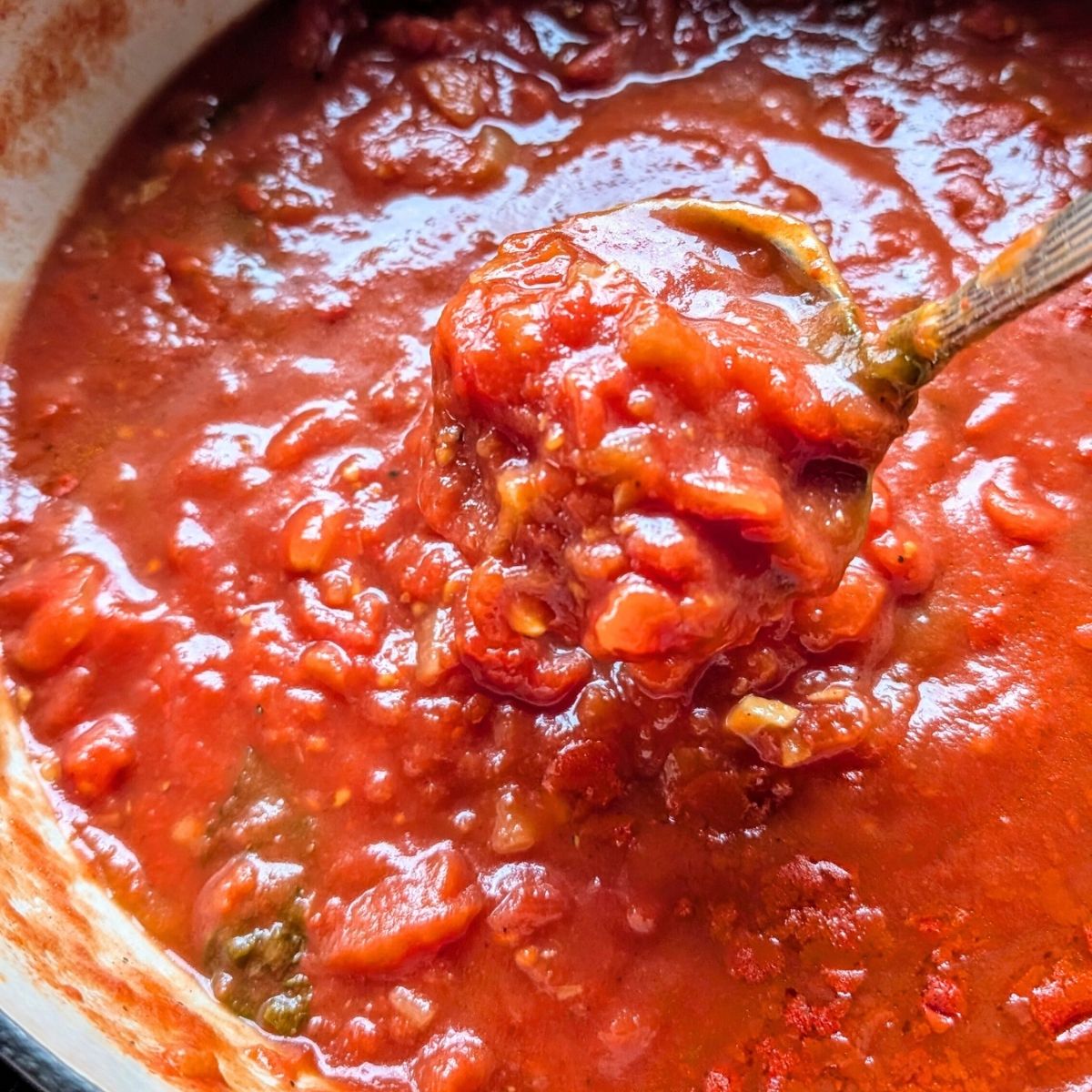 no salt added tomato sauce stirred with a spoon for a chunky sauce without salt.