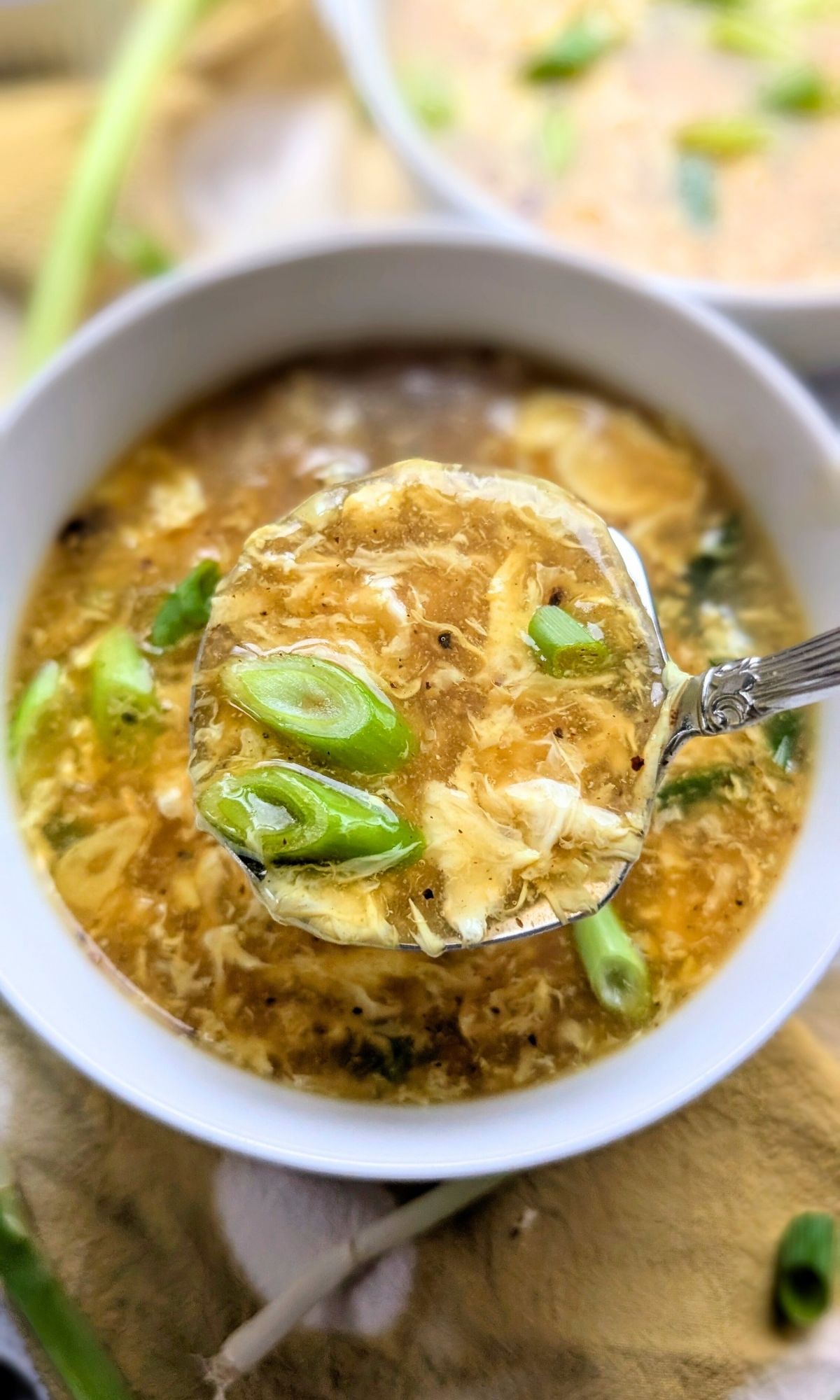 thick unsalted egg drop soup with green onions garlic and sesame oil