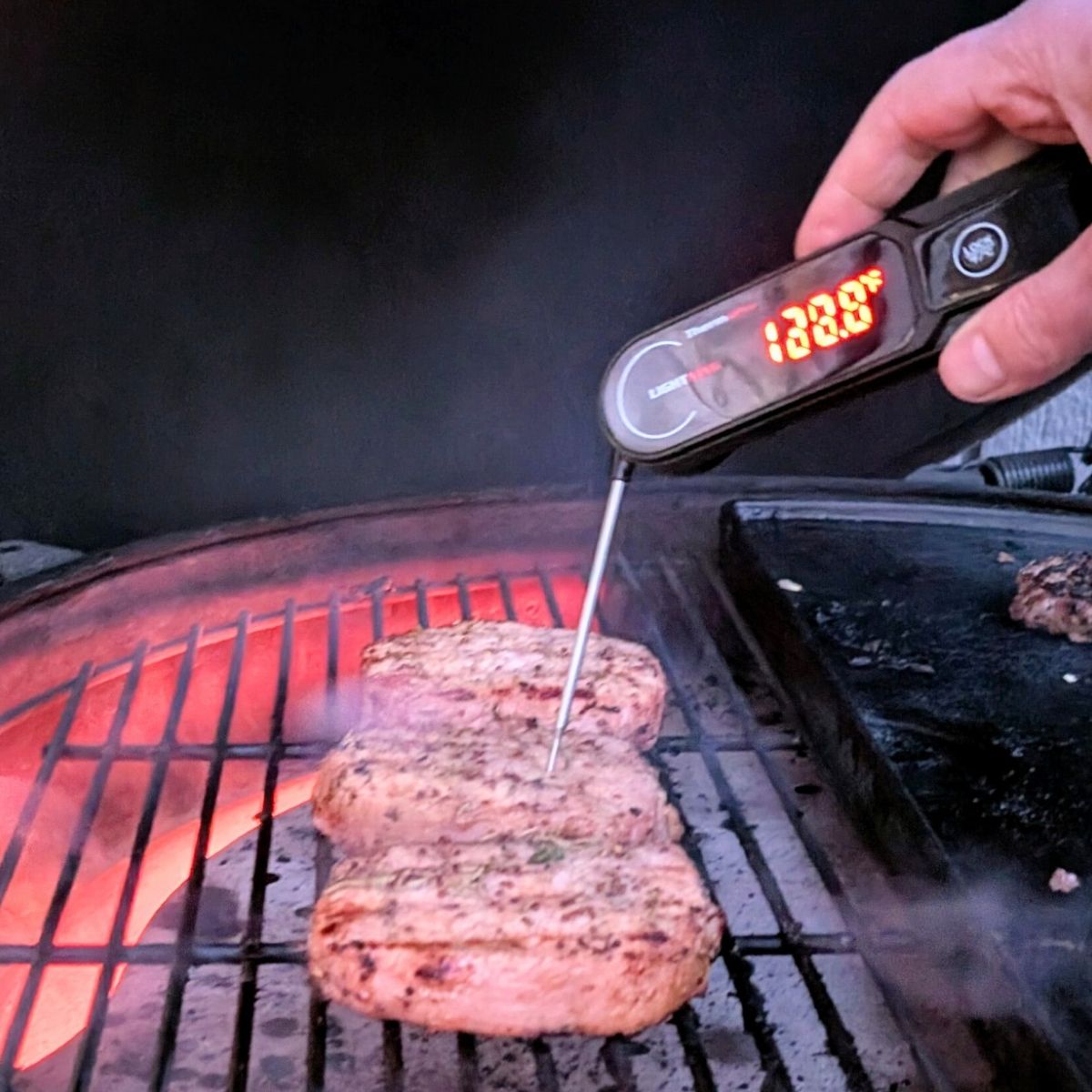 low sodium pork on a grill with a meat thermometer