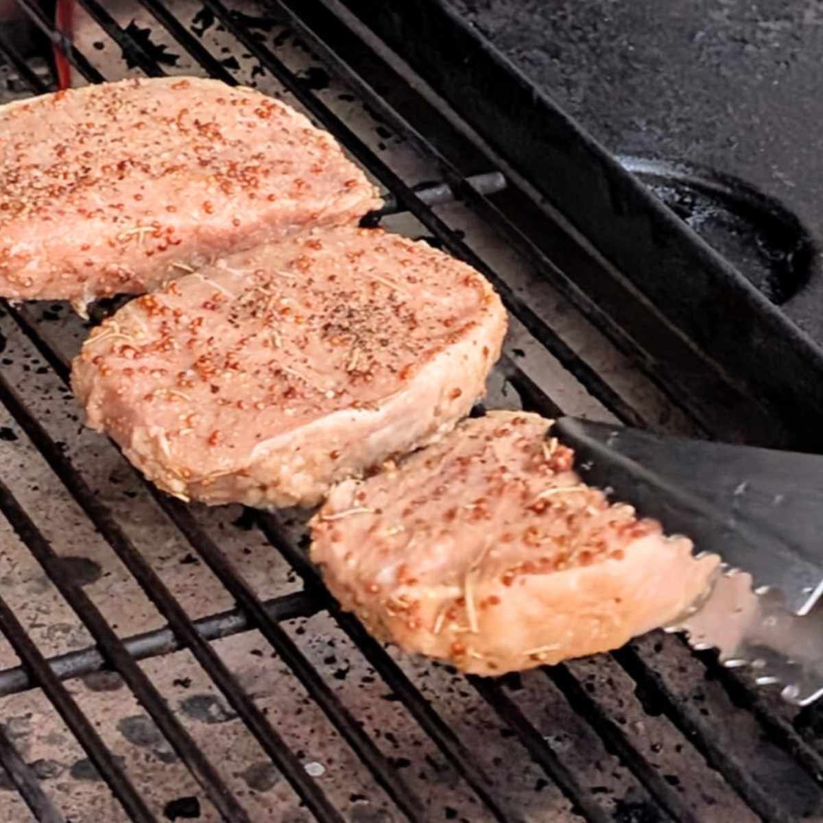 pork chops on grill grates for a low sodium gilling recipe for dinner