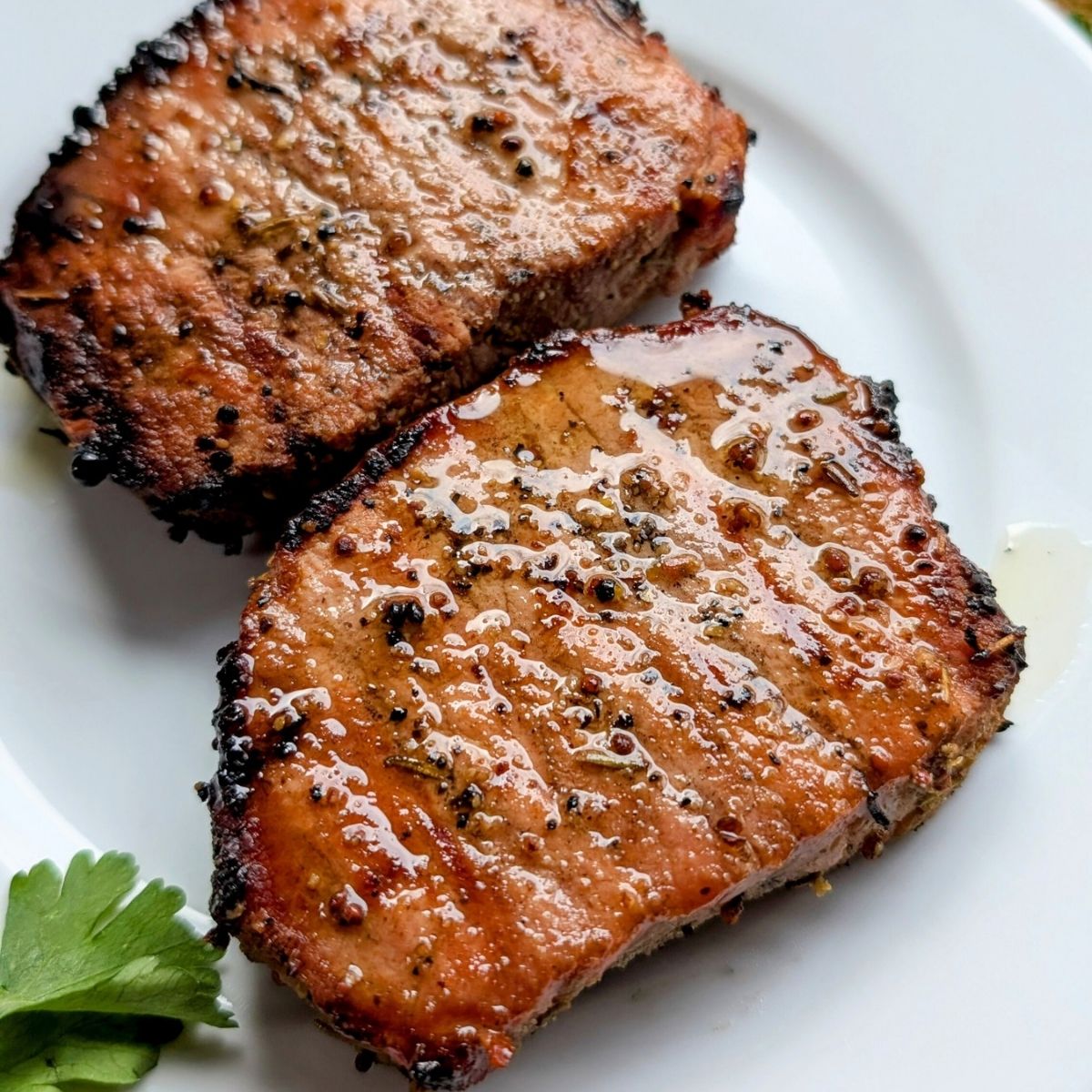 low sodium pork chops on a plate with grill marks and spices on top no salt added!