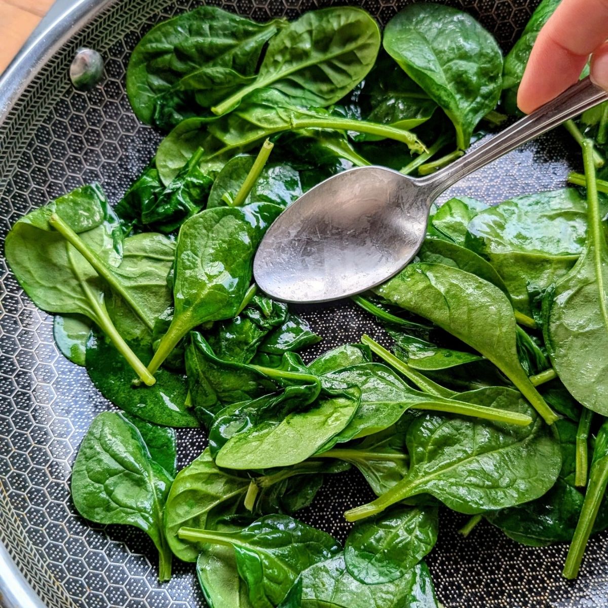 low sodium wilted spinach in a non-stick skillet cooked with unsalted butter.