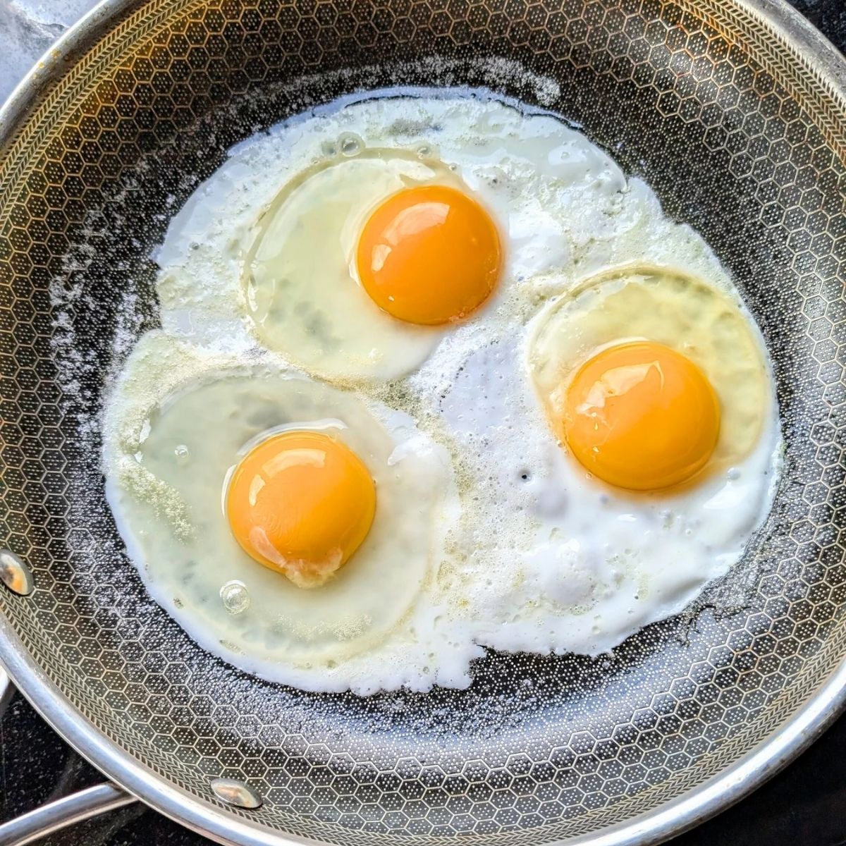 cracked eggs in a non-stick skillet to make low sodium breakfast sandwiches without salt