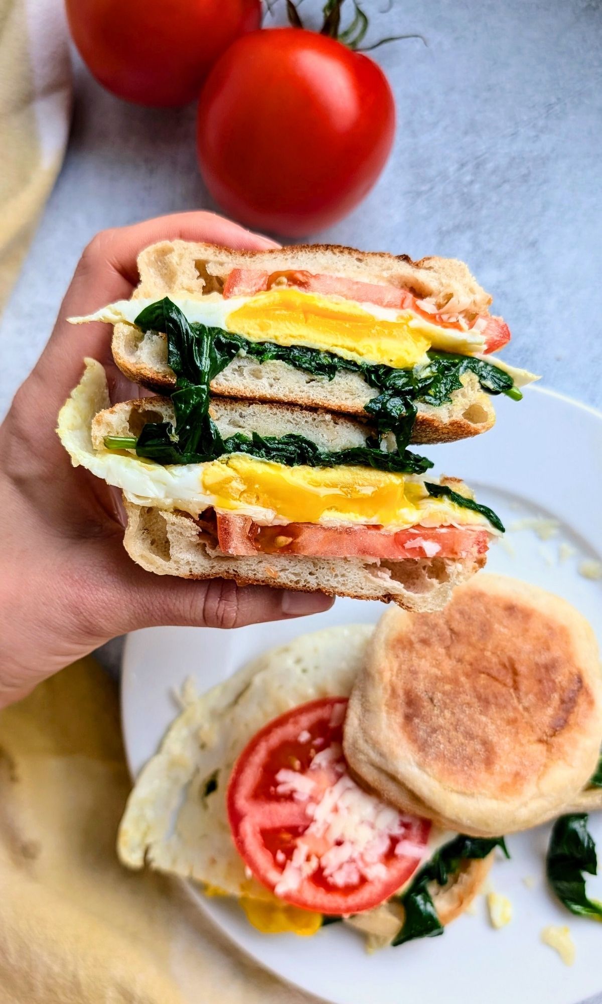 a tasty low sodium breakfast idea with eggs tomato and savory spinach and english muffins