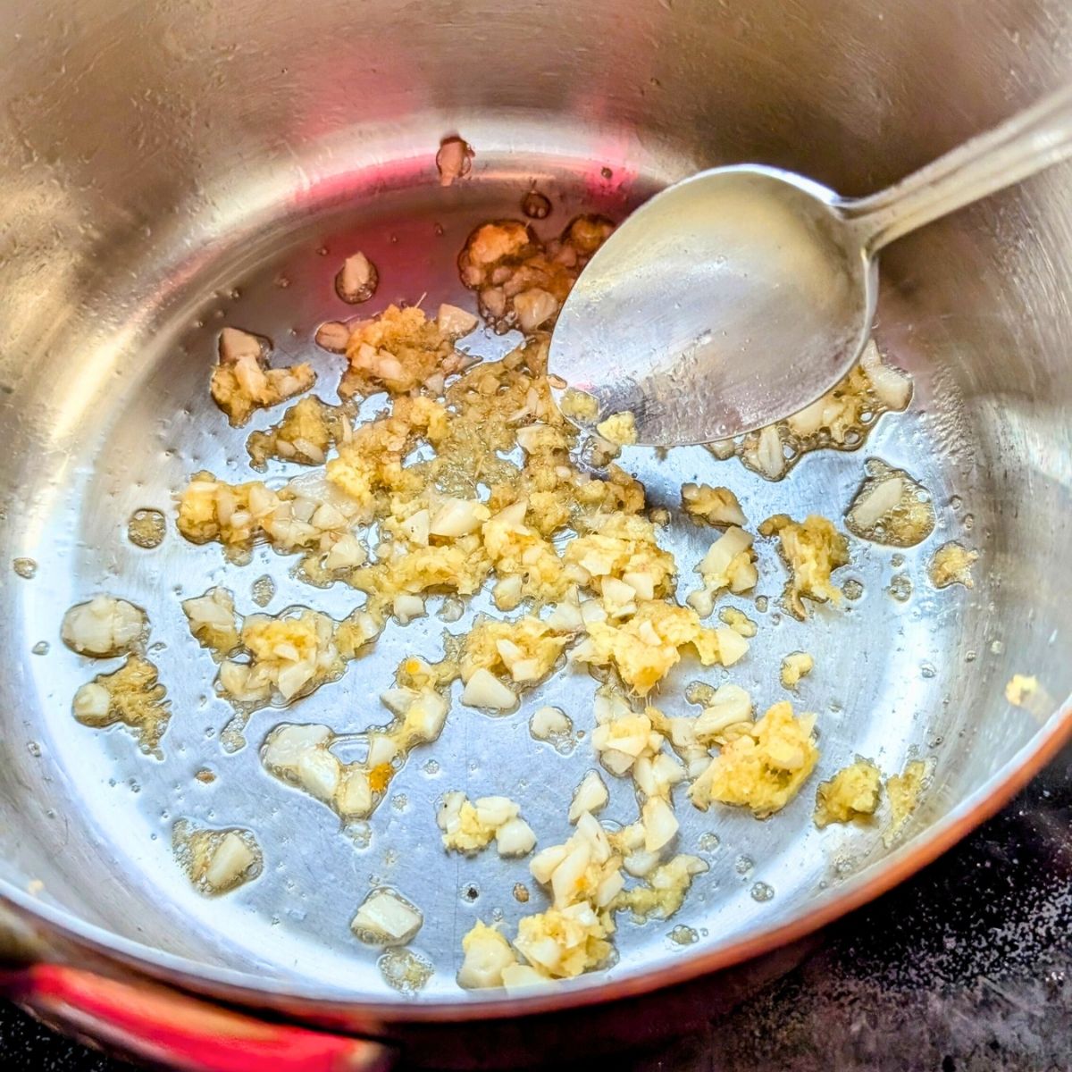 a small pot with garlic and ginger and sesame oil for a low sodium stir fry sauce