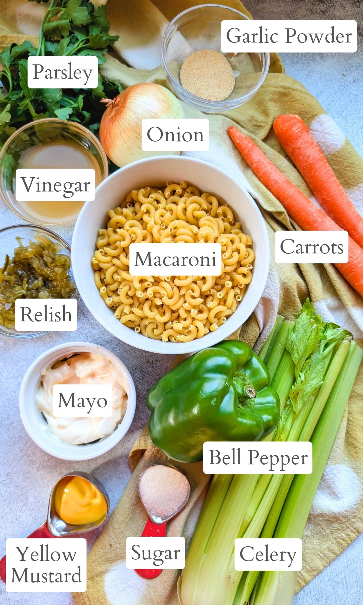 ingredients for low sodium macaroni salad like salt free mayo, vegetables, vinegar, relish, and pasta