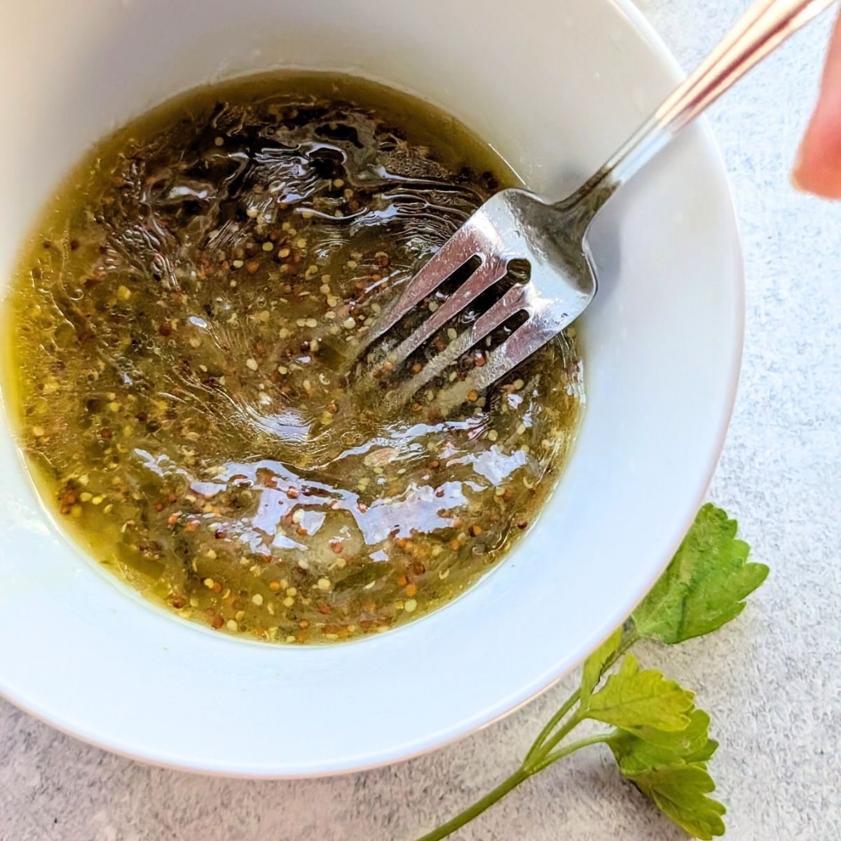 a fork mixing bean salad dressing for bean salad without salt