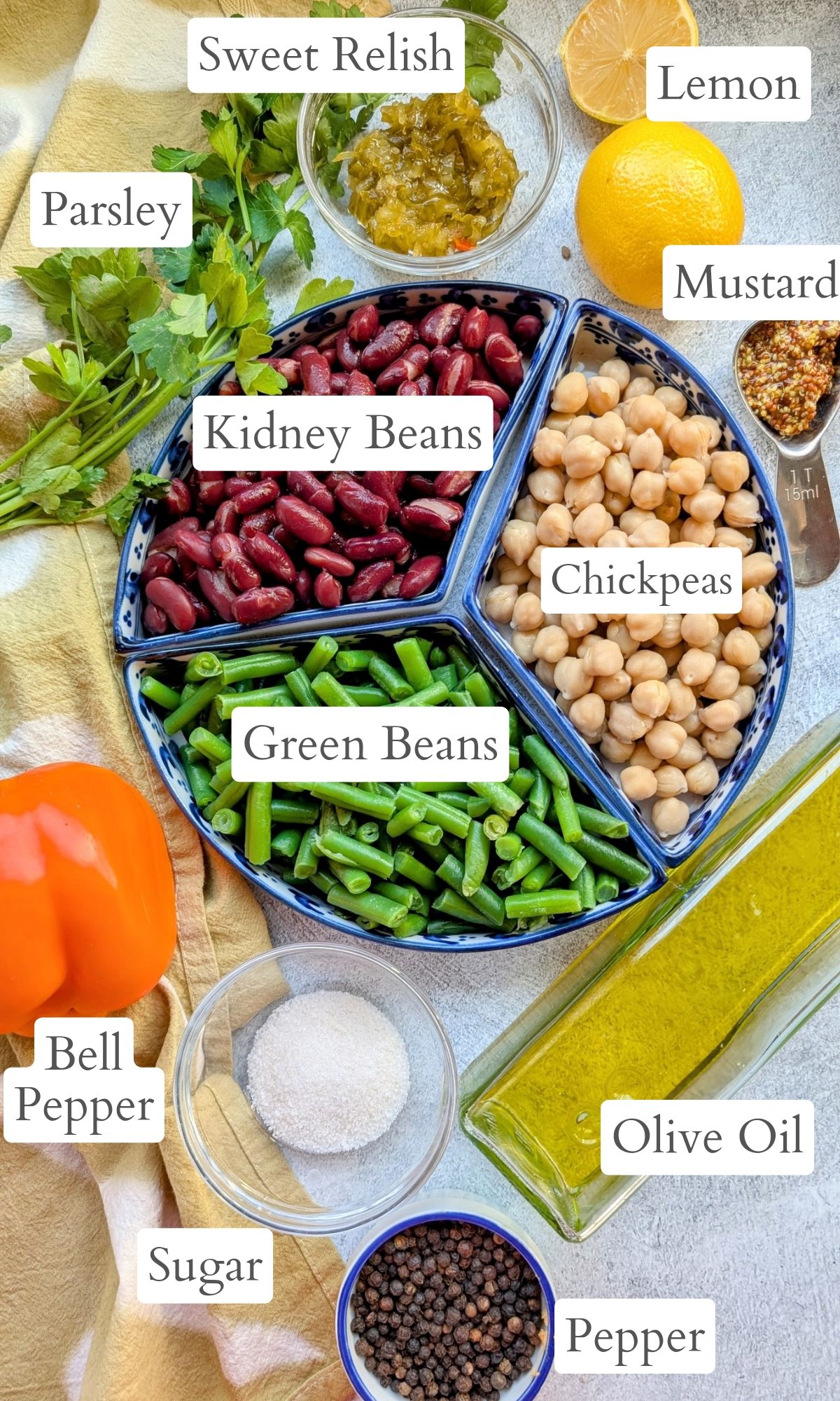 low sodium bean salad ingredients like chickpeas, kidney beans, green beans, bell pepper, olive oil, vinegar, and sugar.