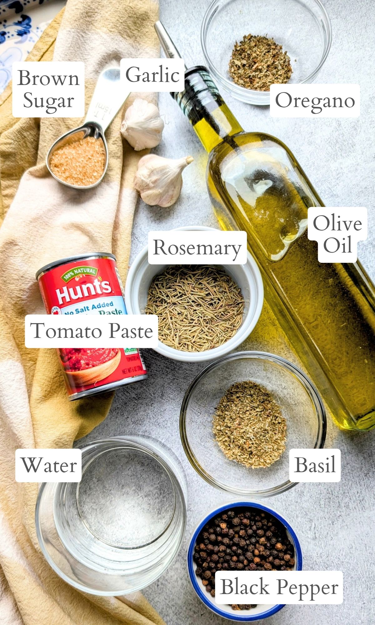 ingredients for homemade pizza sauce with no salt added tomato paste and olive oil and herbs and garlic