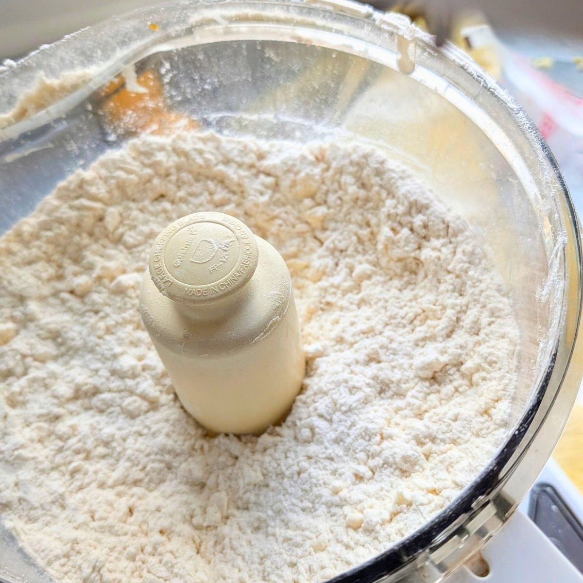 unsalted butter, flour, and sugar mixed in a food processor for unsalted pie dough