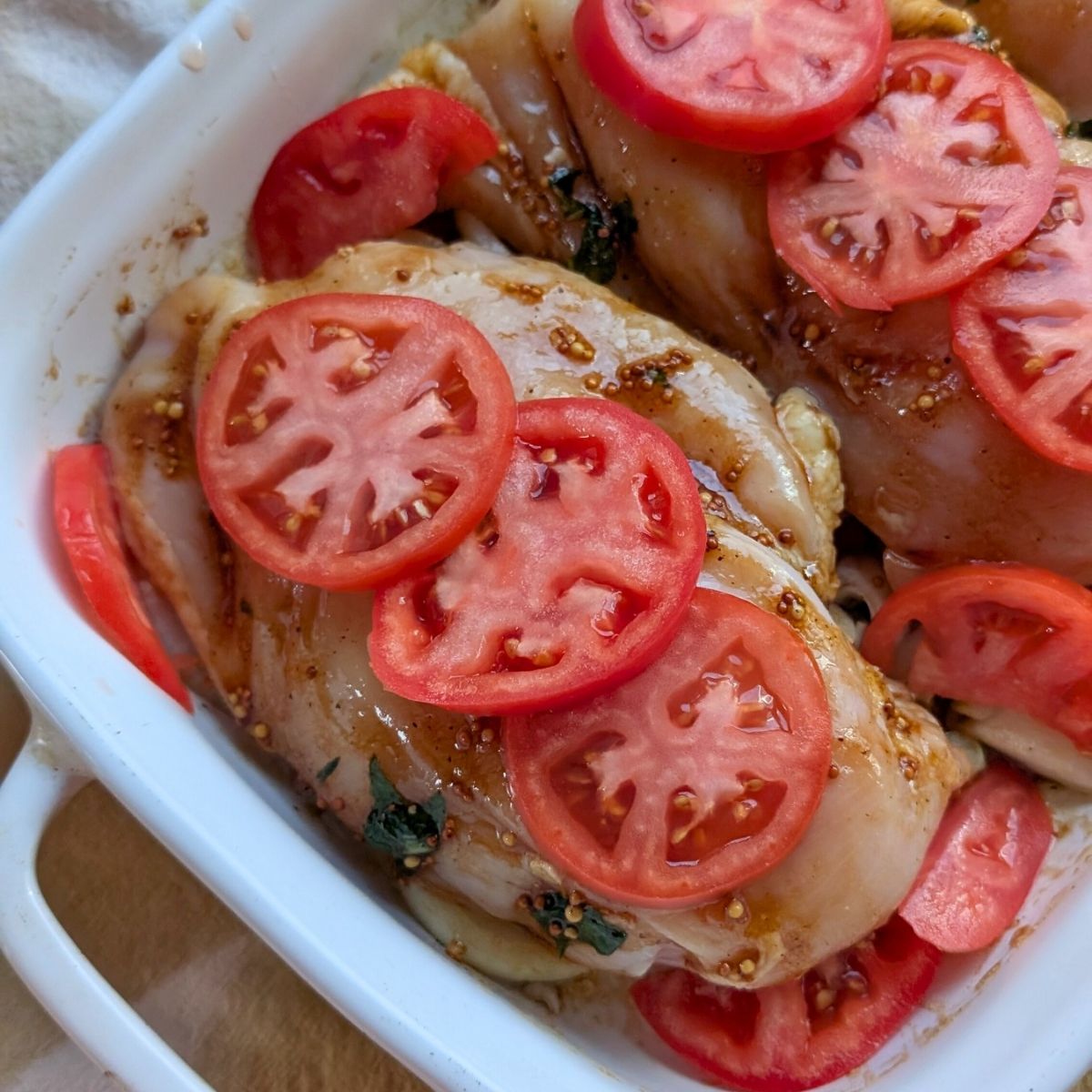 sliced fresh tomatoes and onions on chicken breasts for low sodium italian dinner ideas