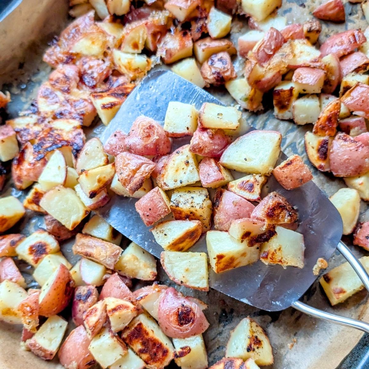 low-sodium potato recipes with garlic and fresh herbs on a sheet pan.