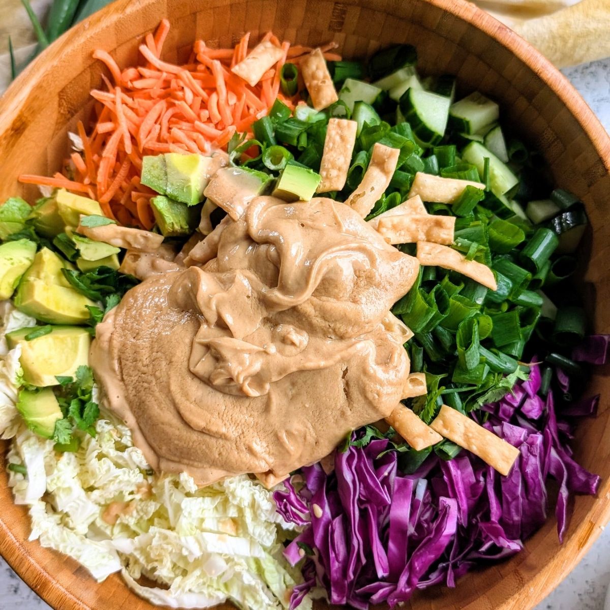a low sodium summer salad without lettuce topped with creamy peanut dressing