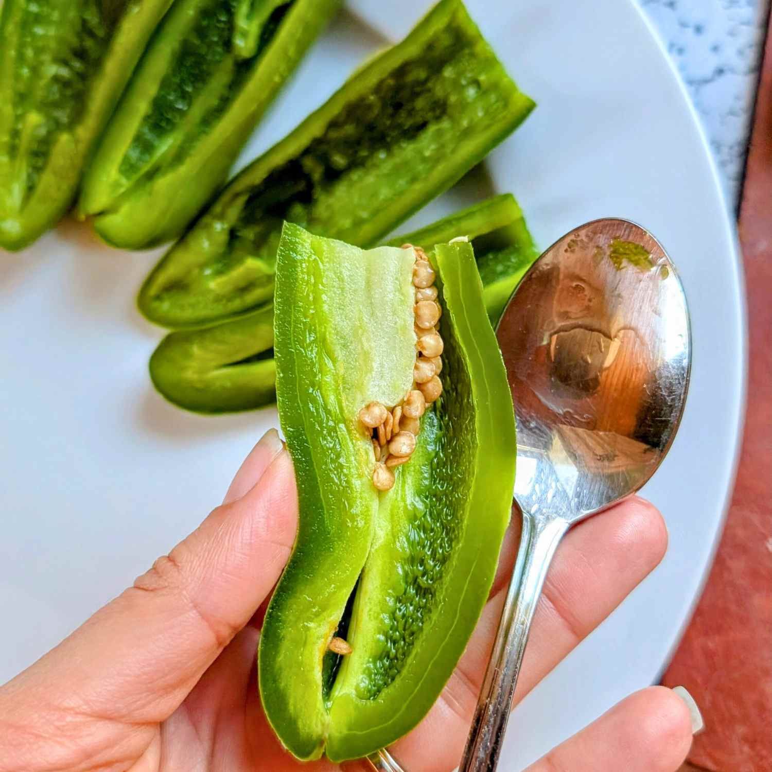 halved jalapeno peppers sliced in half to remove the seeds and spicy membranes.
