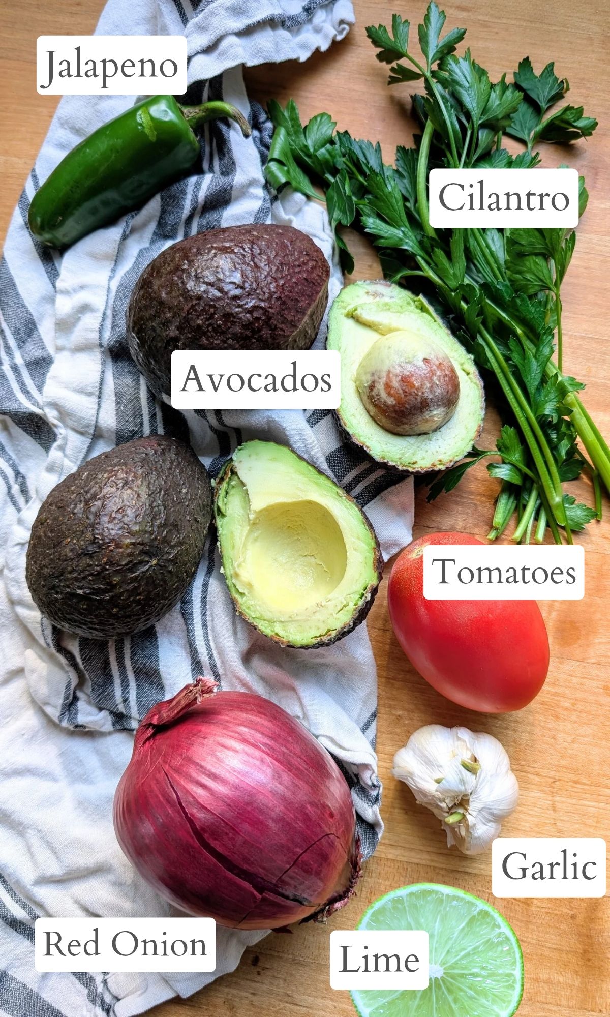 ingredients for guacamole without salt like lime juice, red onion, cilantro, avocado, and garlic.